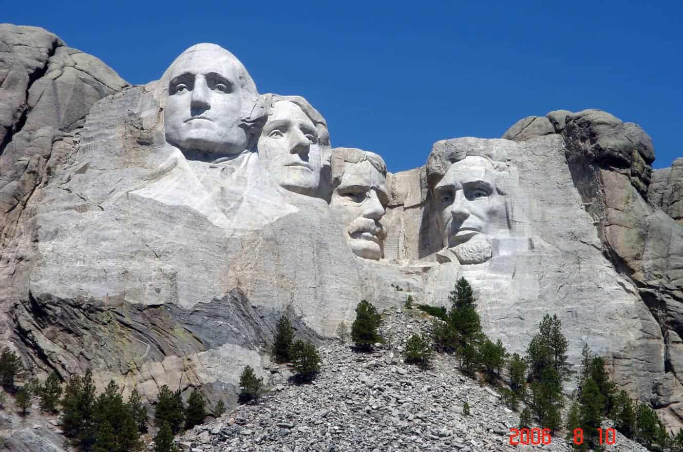 The four presidential faces of Mount Rushmore carved into the granite cliff face