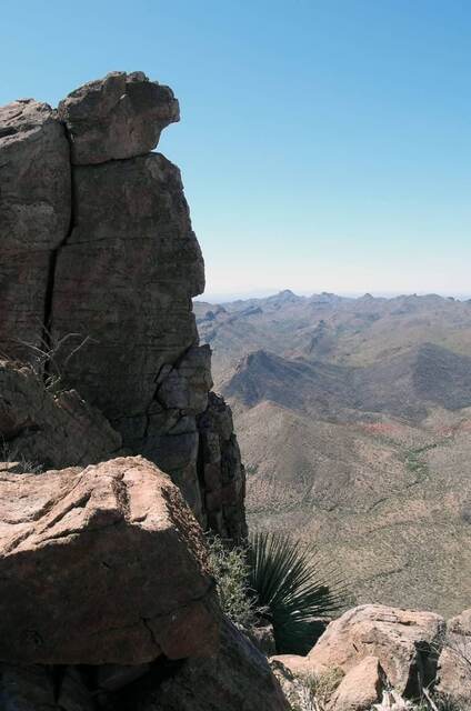 A rocky outcrop near the summit of Picketpost Mountain with a sweeping view of the surrounding mountain ranges