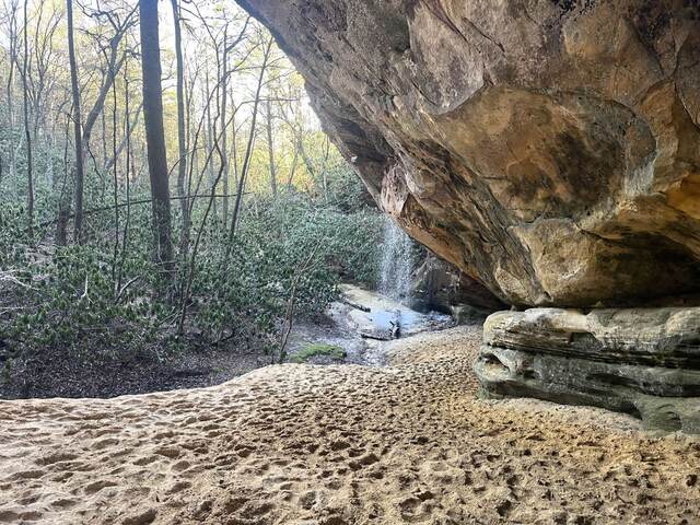 Looking at the waterfall from inside the entrance of the sand cave